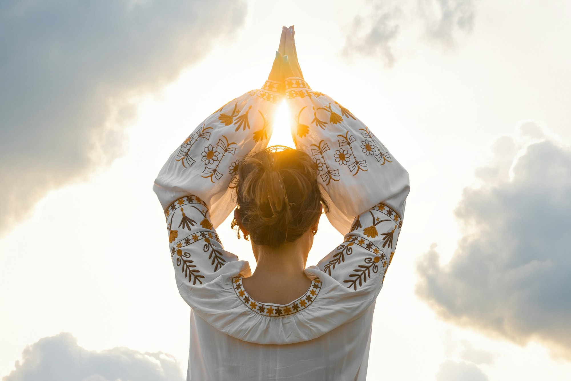 Female hands against in namaste, prayer and gratitude. Wise Yoga concept.